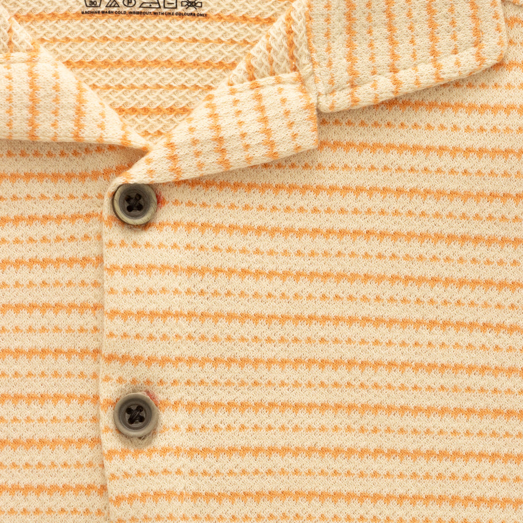 orange stripes boys shirt closeup