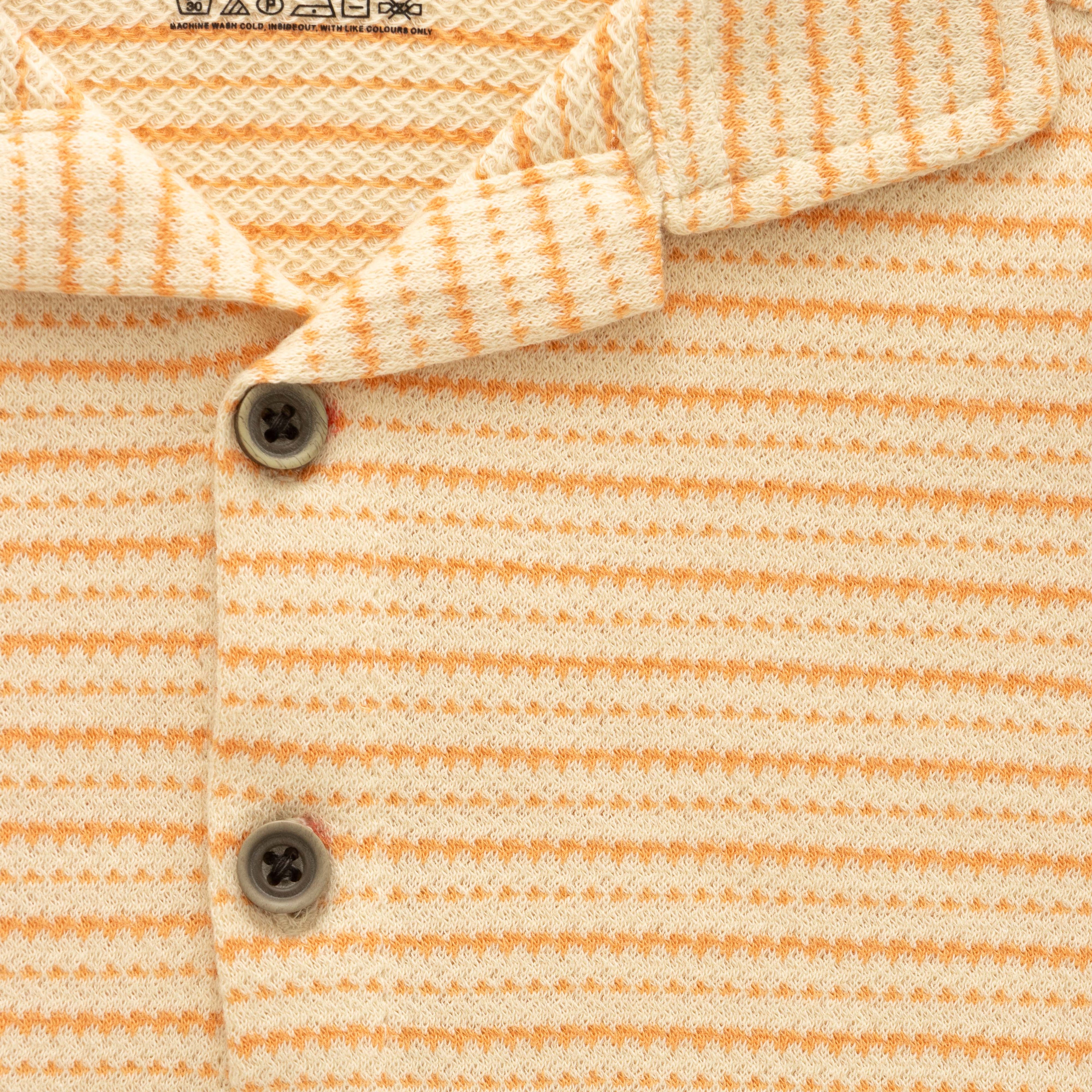 orange stripes boys shirt closeup