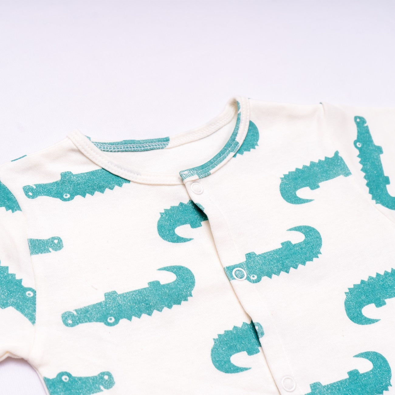 croc printed cotton baby dress closeup