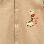 animals printed beige baby clothing set closeup